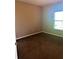 Bedroom featuring carpeted floors and a window at 6957 Northwich Dr, Windermere, FL 34786