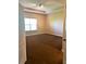Bright, airy bedroom with carpet flooring and a window providing natural light at 6957 Northwich Dr, Windermere, FL 34786