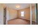 A bright bedroom featuring a carpeted floor, window with blinds, and beige walls at 6957 Northwich Dr, Windermere, FL 34786