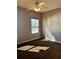 Neutral bedroom with a ceiling fan, window with blinds, and plush carpeting at 6957 Northwich Dr, Windermere, FL 34786