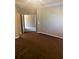 Spacious bedroom featuring neutral walls and a carpeted floor, providing a blank canvas for customization at 6957 Northwich Dr, Windermere, FL 34786