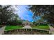 Charming community building surrounded by manicured landscaping, walking paths, and mature trees at 6957 Northwich Dr, Windermere, FL 34786