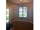 Cozy dining area with tiled floor and plenty of natural light from the windows and door at 6957 Northwich Dr, Windermere, FL 34786