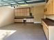 Functional garage features ample storage with wall-mounted cabinets and sink at 6957 Northwich Dr, Windermere, FL 34786