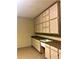 Functional garage features ample storage with wall-mounted cabinets and sink at 6957 Northwich Dr, Windermere, FL 34786