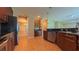 Well-appointed kitchen with stainless steel appliances, dark countertops, and wood cabinets at 6957 Northwich Dr, Windermere, FL 34786