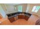 Open kitchen featuring stainless steel appliances, a double sink, and granite countertops at 6957 Northwich Dr, Windermere, FL 34786