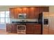 Modern kitchen features stainless steel appliances, granite countertops, and ample cabinet space at 6957 Northwich Dr, Windermere, FL 34786