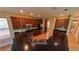 Kitchen featuring stainless steel appliances, dark countertops, and wood cabinetry at 6957 Northwich Dr, Windermere, FL 34786