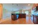 Open kitchen showcasing tile floors, stainless steel appliances, and granite countertops at 6957 Northwich Dr, Windermere, FL 34786