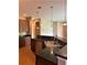 Stylish kitchen boasts modern fixtures, dark countertops, and tiled flooring at 6957 Northwich Dr, Windermere, FL 34786