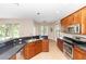 Bright kitchen with stainless steel appliances and countertops with backyard views at 6957 Northwich Dr, Windermere, FL 34786