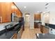 Well-lit kitchen features stainless steel appliances, granite countertops, and ample cabinet space at 6957 Northwich Dr, Windermere, FL 34786
