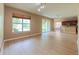 Bright living room with wood floors and views into the kitchen and outdoor space at 6957 Northwich Dr, Windermere, FL 34786