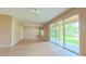 Spacious living room with sliding glass doors leading to the outdoors at 6957 Northwich Dr, Windermere, FL 34786