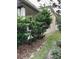 View of the side yard with greenery at 6957 Northwich Dr, Windermere, FL 34786