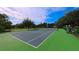 Well-maintained tennis court surrounded by lush greenery, offering a great space for active recreation at 6957 Northwich Dr, Windermere, FL 34786