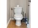 Close-up of a white toilet with a tiled floor and beige walls at 6957 Northwich Dr, Windermere, FL 34786