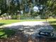 Community sand volleyball court and picnic table, nestled in a grassy park-like setting at 6957 Northwich Dr, Windermere, FL 34786