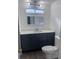 Clean and updated bathroom featuring a gray vanity, white countertop, and modern fixtures at 710 Whispering Pines Dr, Auburndale, FL 33823