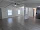 Bright and airy living room featuring wood-look floors and an open layout ideal for entertaining at 710 Whispering Pines Dr, Auburndale, FL 33823