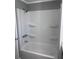 Clean and updated white shower/tub combo at 710 Whispering Pines Dr, Auburndale, FL 33823