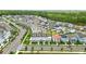 Beautiful aerial view of a neighborhood with townhouses, single-Gathering homes, and lush greenery at 7400 Estuary Lake Loop, Celebration, FL 34747