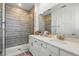 Bright bathroom features a walk-in shower, a double sink vanity, and modern fixtures at 7400 Estuary Lake Loop, Celebration, FL 34747