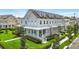 A stylish townhome featuring a welcoming front porch and well-maintained landscaping at 7400 Estuary Lake Loop, Celebration, FL 34747