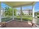 Charming front porch featuring brick flooring and views of the neighborhood at 7400 Estuary Lake Loop, Celebration, FL 34747