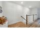 Bright hallway with hardwood floors and white walls offers a clean, modern aesthetic at 7400 Estuary Lake Loop, Celebration, FL 34747