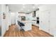 Modern kitchen featuring sleek white cabinetry, stainless steel appliances, and a spacious island with bar seating at 7400 Estuary Lake Loop, Celebration, FL 34747