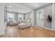 Spacious living room featuring a comfortable sectional couch and large windows providing plenty of natural light at 7400 Estuary Lake Loop, Celebration, FL 34747