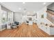 Bright living room with open floor plan features recessed lighting, modern floors and adjacent kitchen and dining area at 7400 Estuary Lake Loop, Celebration, FL 34747