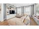 Comfortable living room boasting a large sectional couch and custom built-ins, ideal for entertaining and relaxation at 7400 Estuary Lake Loop, Celebration, FL 34747