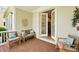 Cozy outdoor seating area with brick flooring and comfortable furniture at 7400 Estuary Lake Loop, Celebration, FL 34747