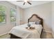 Cozy bedroom with a comfortable bed, a window with blinds, and a peaceful ambiance at 8042 Glenlloyd Ave, Winter Garden, FL 34787