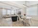 Open-concept living space featuring a dining area and a comfortable living room with bright natural light at 8042 Glenlloyd Ave, Winter Garden, FL 34787