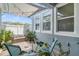 Relaxing patio area with comfortable seating, string lights and potted plants at 8042 Glenlloyd Ave, Winter Garden, FL 34787