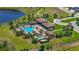 Aerial view of a resort-style pool, clubhouse, and landscaped grounds in the community at 8042 Glenlloyd Ave, Winter Garden, FL 34787