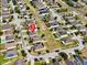 Aerial view of the neighborhood with well-maintained lawns, sidewalks, and mature trees at 810 Jefferson Blvd, Haines City, FL 33844