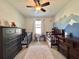 Shared bedroom with coordinating beds, mountain mural, and soft lighting for a comforting feel at 810 Jefferson Blvd, Haines City, FL 33844