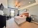 Comfortable bedroom featuring a ceiling fan, wooden headboard, and a large window for natural light at 810 Jefferson Blvd, Haines City, FL 33844