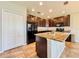 Modern kitchen with granite island, stainless steel appliances, and ample cabinet space for functionality at 810 Jefferson Blvd, Haines City, FL 33844
