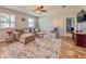 Inviting living room with comfortable seating, stylish rug, and ample natural light, creating a relaxing ambiance at 810 Jefferson Blvd, Haines City, FL 33844