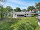 Large backyard with a screened lanai and a concrete patio extending from the rear of the home at 818 Ballard St, Altamonte Springs, FL 32701