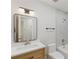 Well-lit bathroom with a modern sink, framed mirror, and tiled shower at 818 Ballard St, Altamonte Springs, FL 32701