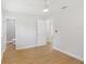 Bedroom with vinyl floors, ceiling fan, and an attached bathroom at 818 Ballard St, Altamonte Springs, FL 32701