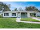 Inviting home with well-maintained lawn, fresh landscaping, and a neatly paved walkway at 818 Ballard St, Altamonte Springs, FL 32701