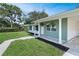 Home's exterior showcasing fresh landscaping, a freshly paved walkway, and a nicely kept lawn at 818 Ballard St, Altamonte Springs, FL 32701